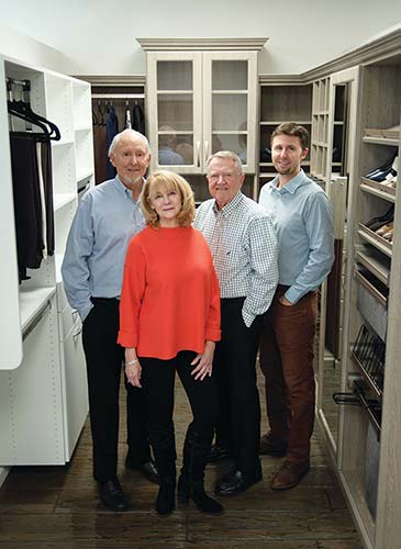 The Premiergarage Knoxville Owners standing in a demo closet